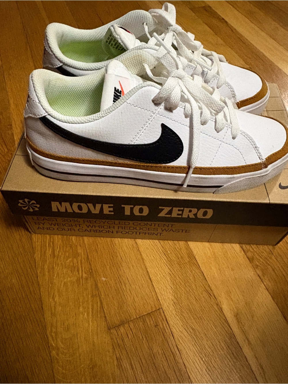 Nike White Low-Top Sneakers with Black Swoosh and Brown Trim- nike court legacy